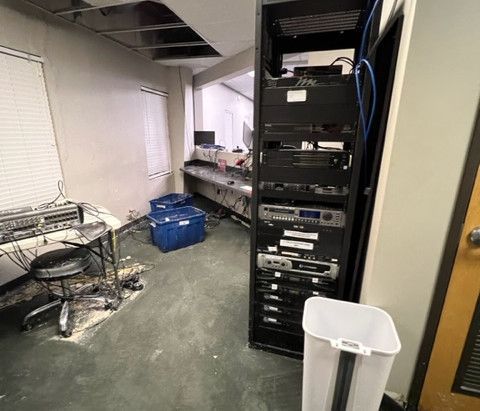 There is a trash can in the middle of the room.