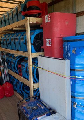 A truck filled with a bunch of boxes and a table.