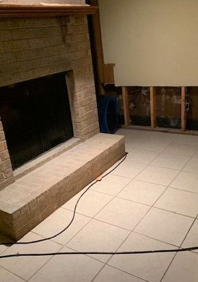 There is a fireplace in the middle of the room.