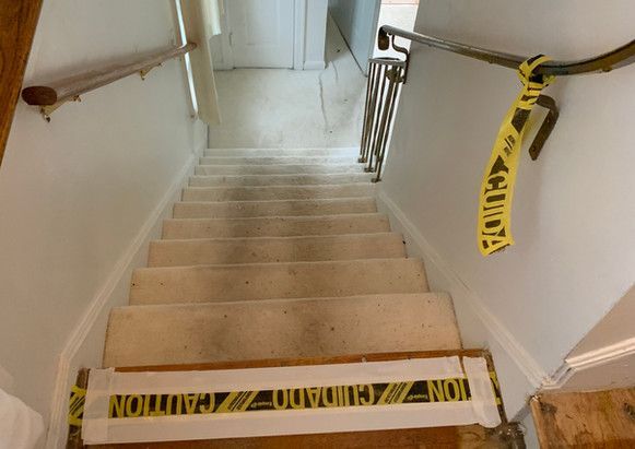 A set of stairs with a caution tape on them