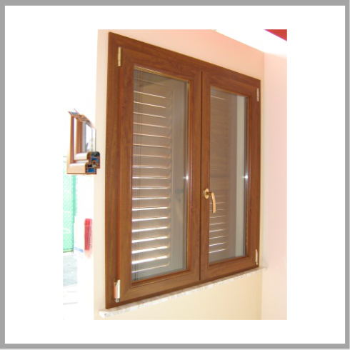 infisso in PVC su finestra di legno