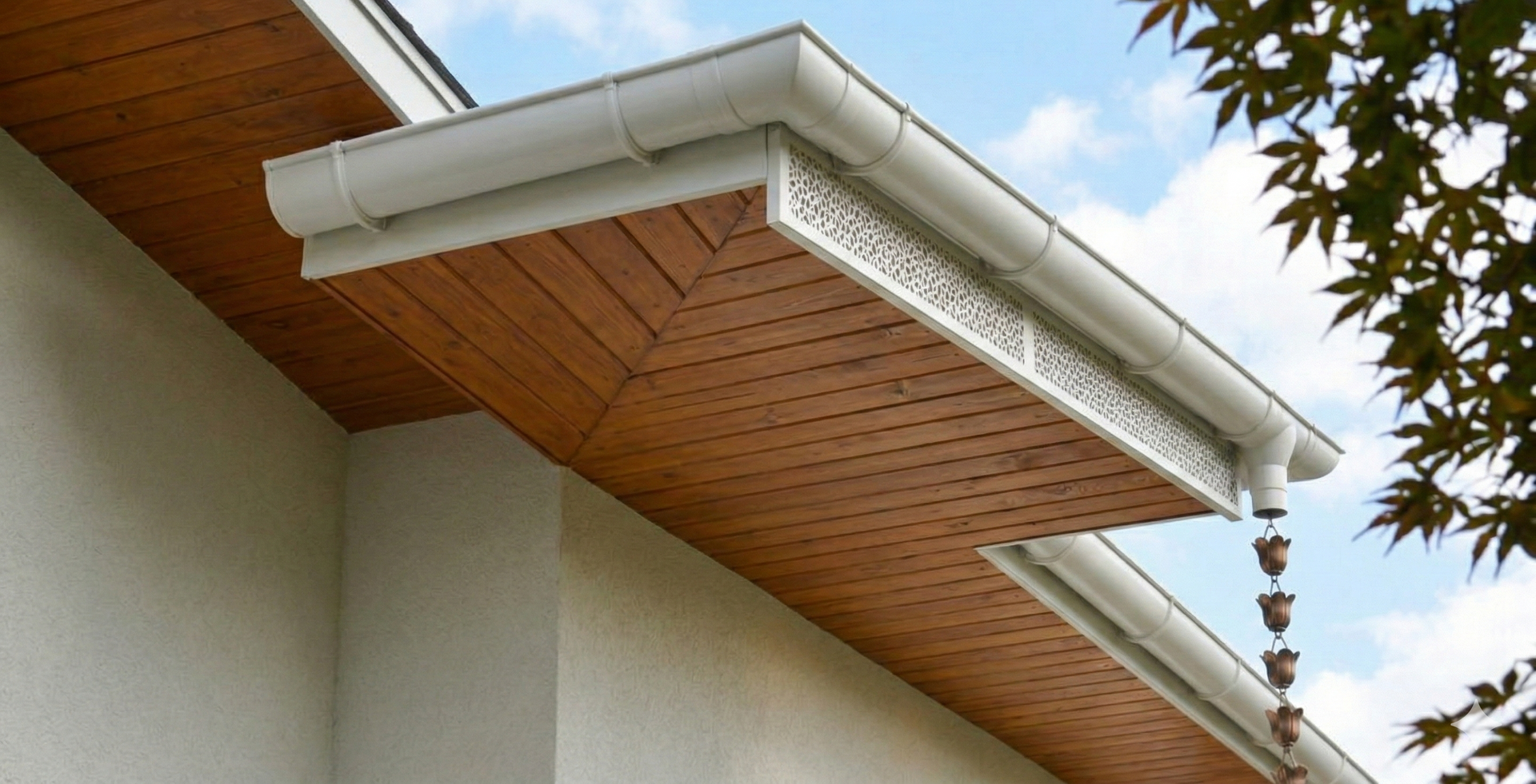White ductless air conditioner mounted on a beige wall next to a window.