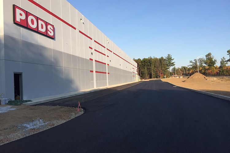 A large building with the word pods on it is being built.