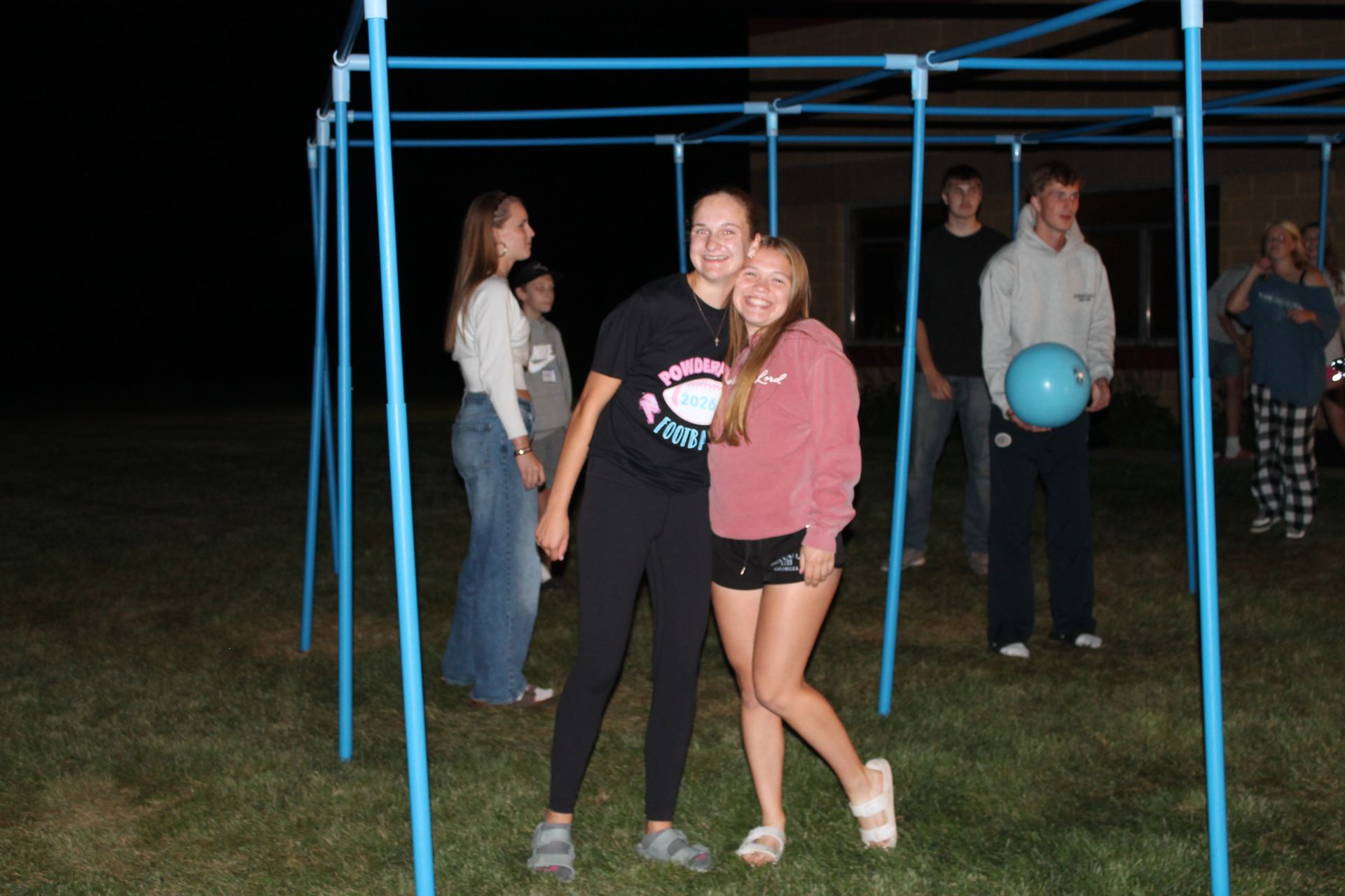 A group of people are sitting in chairs in a room.