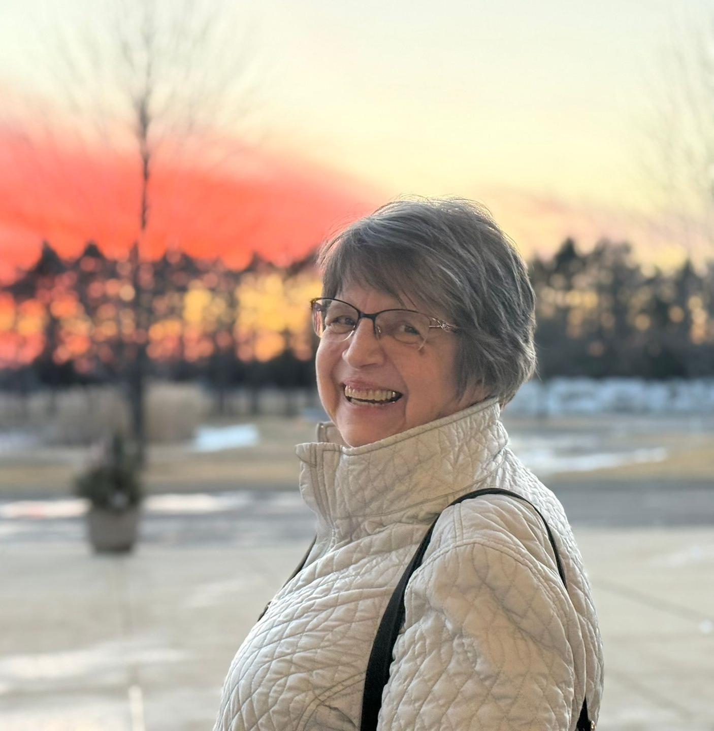 A man and a woman are standing next to each other wearing blue shirts that say celebration.