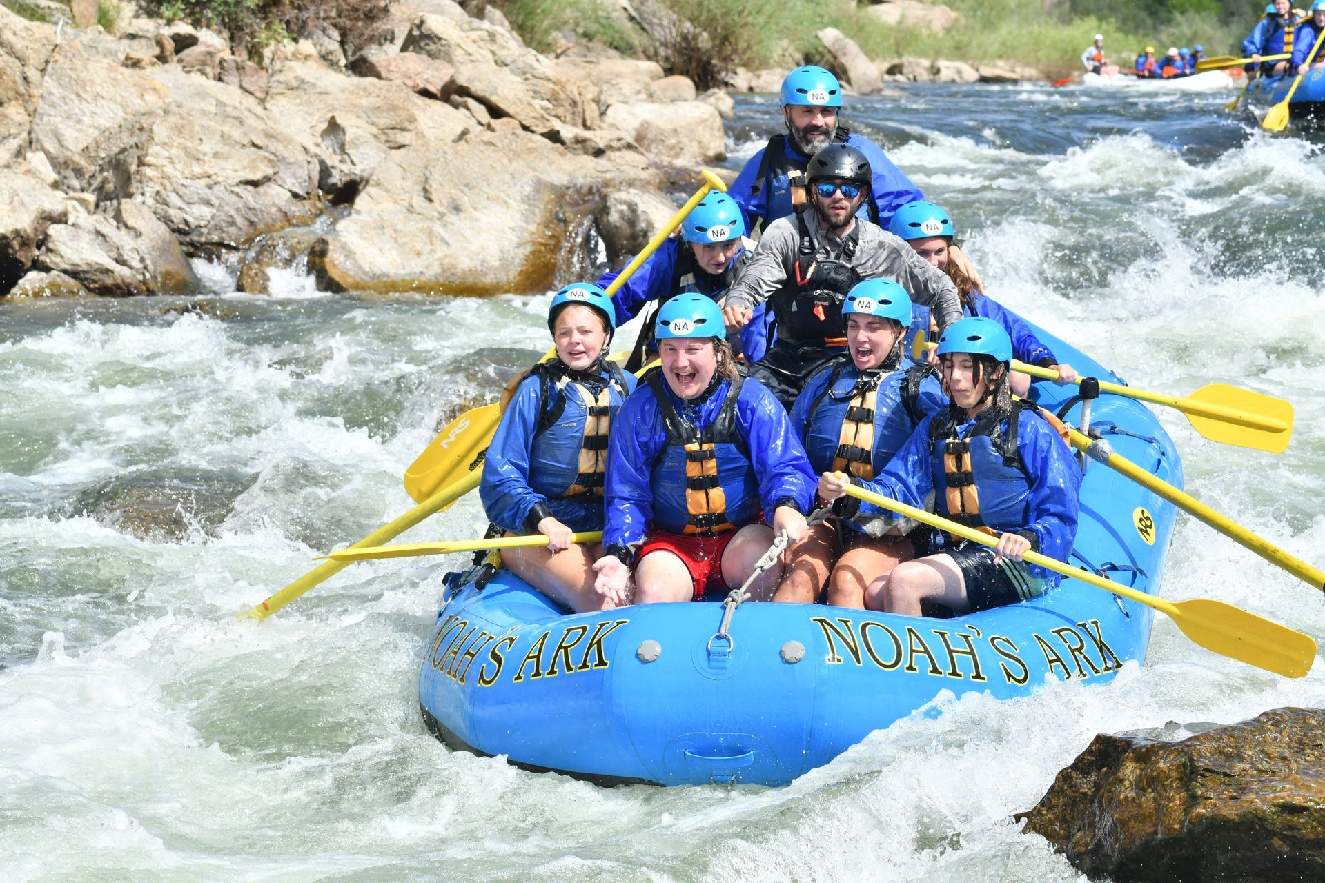 A group of people are rafting down a river.