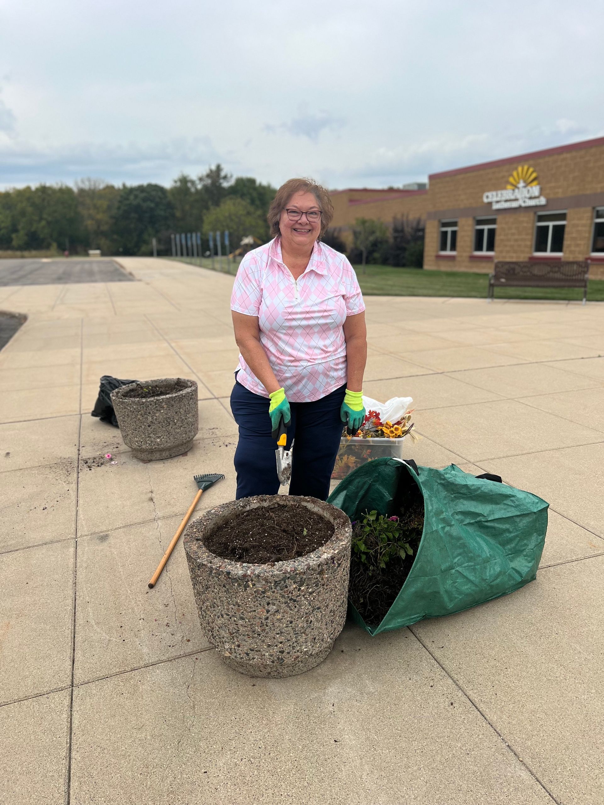 A woman is smiling while using a brother sewing machine