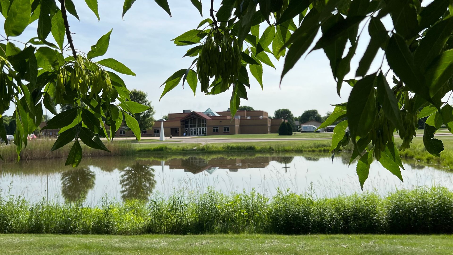 A large body of water with a building in the background