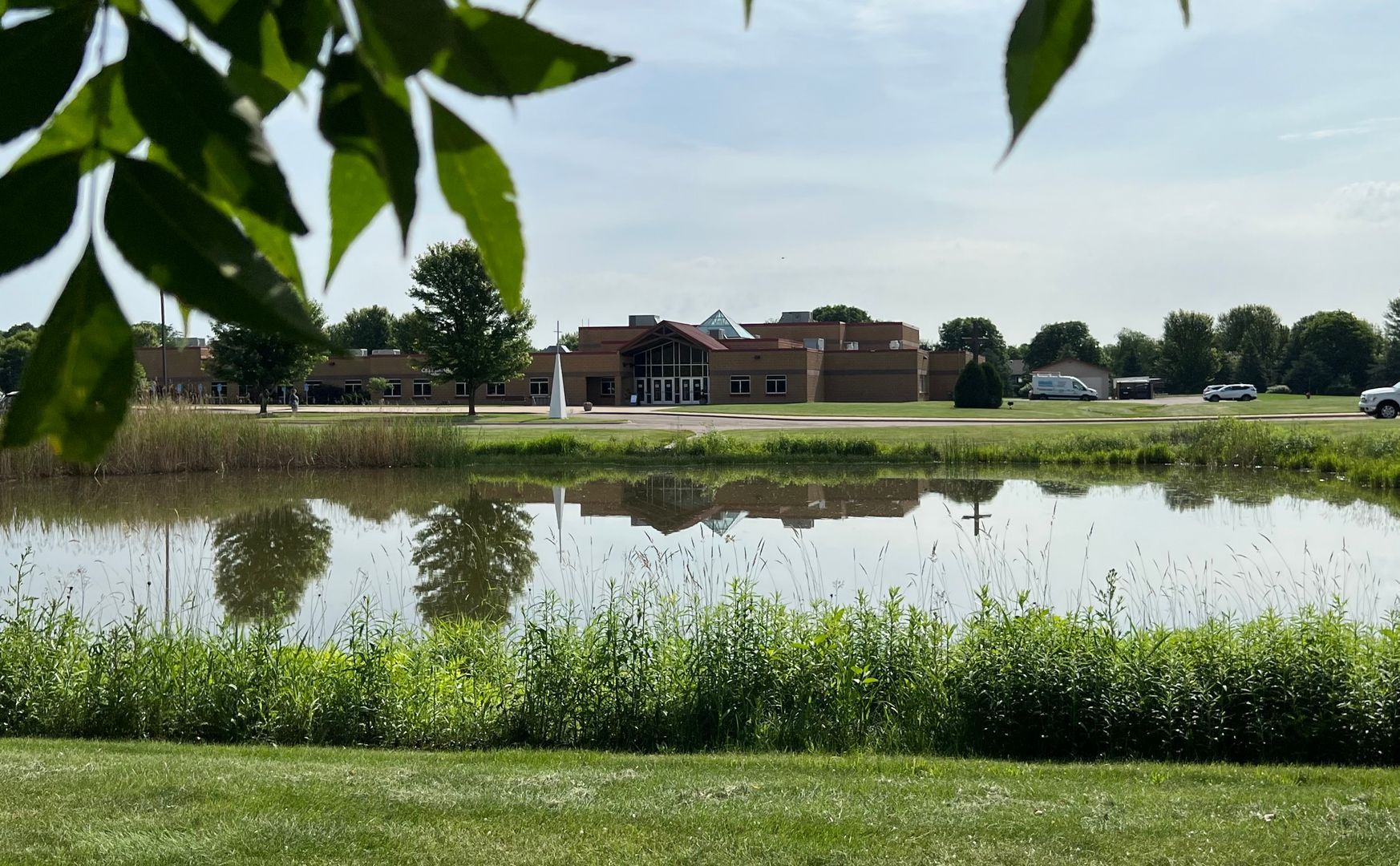 A large body of water with a building in the background