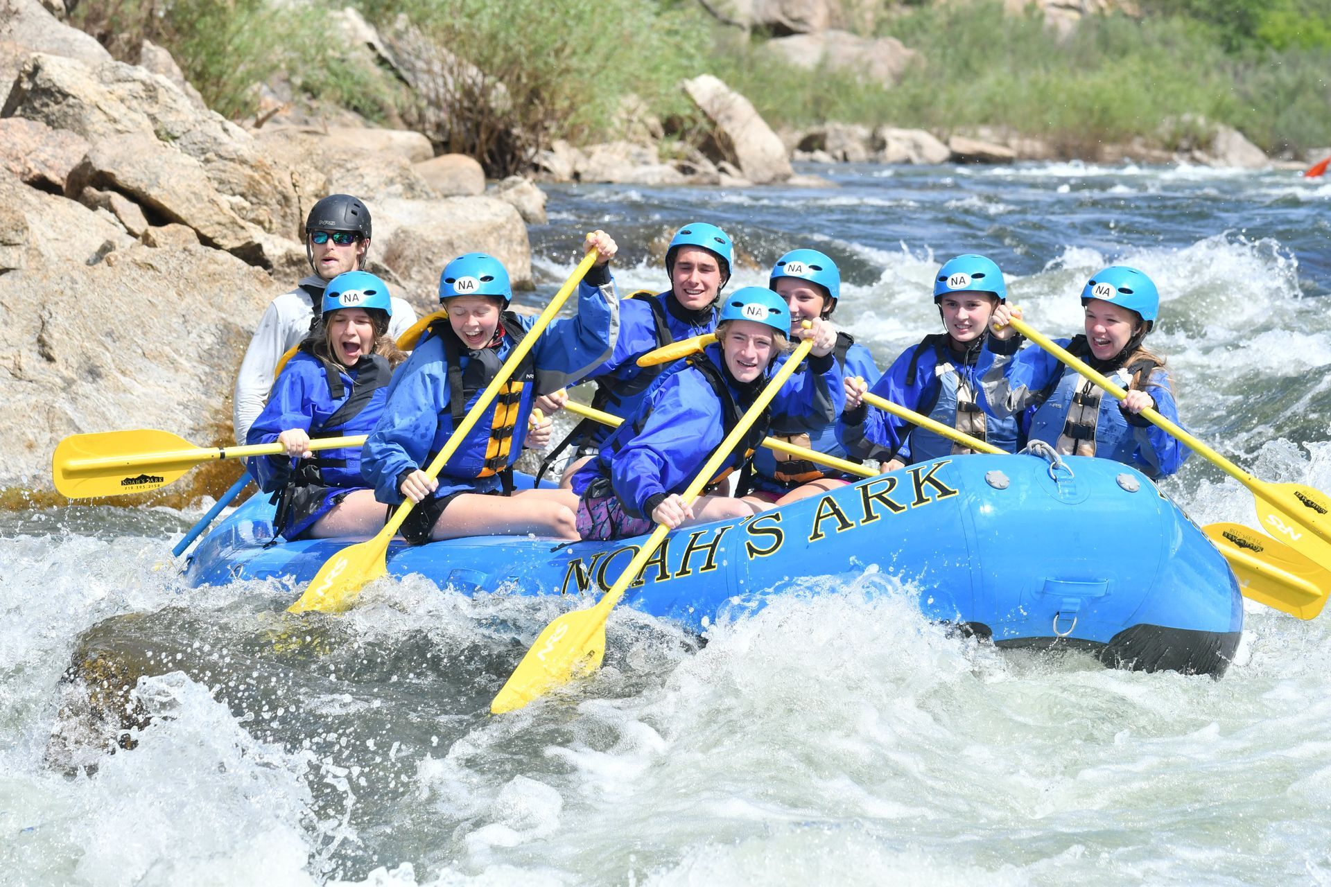 A group of people are rafting down a river.