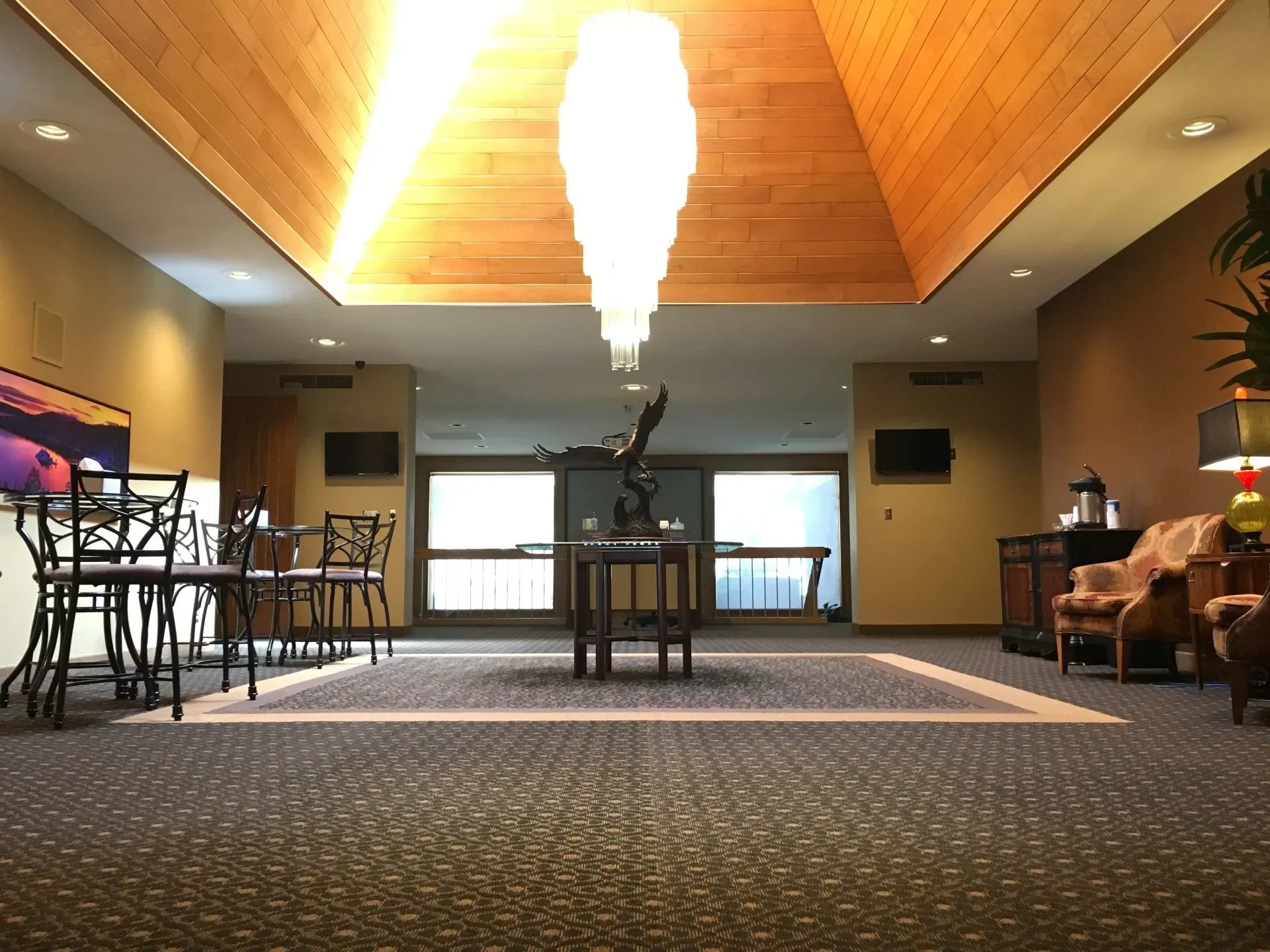 There is a large chandelier in the middle of the room.