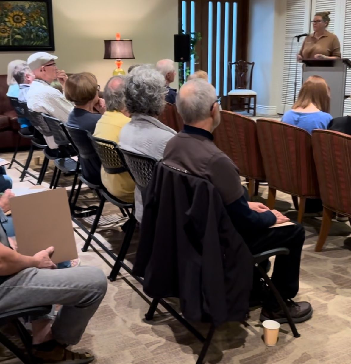 A speaker from Interra Green Burial by Mueller Memorial is speaking to an audience.
