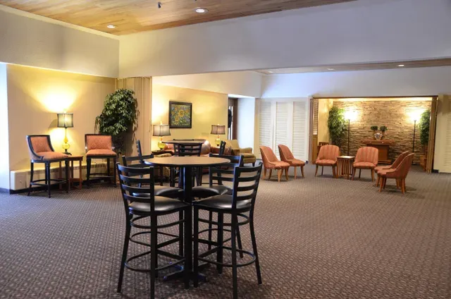 A large room with tables and chairs in it