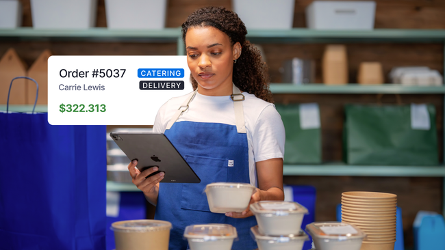 woman looking at catering order on iPad