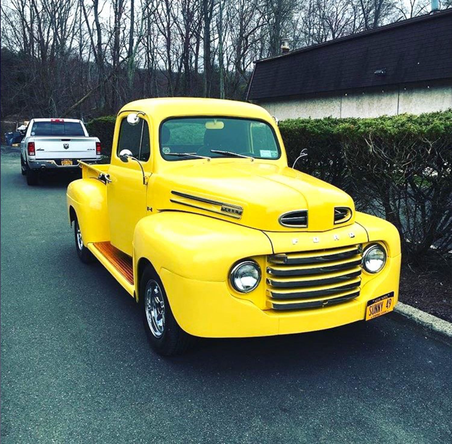 A yellow truck with a new york license plate