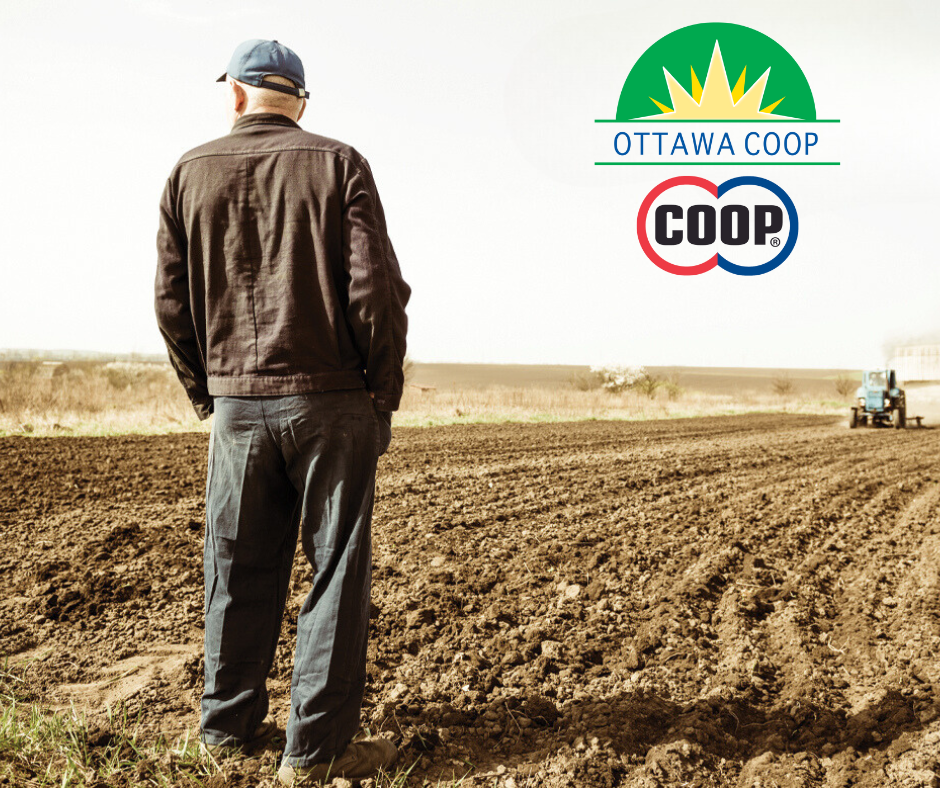 Farmer standing in a field with the COOP logo over open land