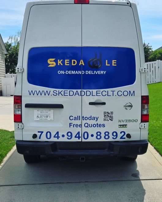White van with blue and gold 
