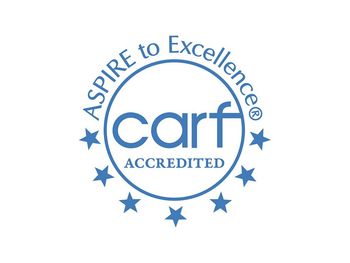 Aspire to excellence carf accredited logo on a white background