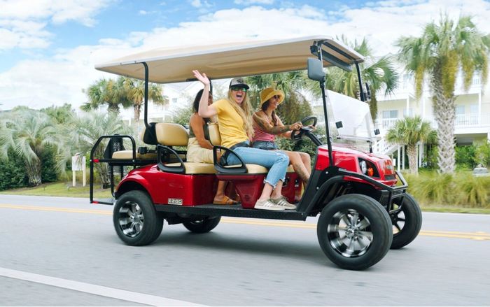 girls in a golf cart rental in destin florida