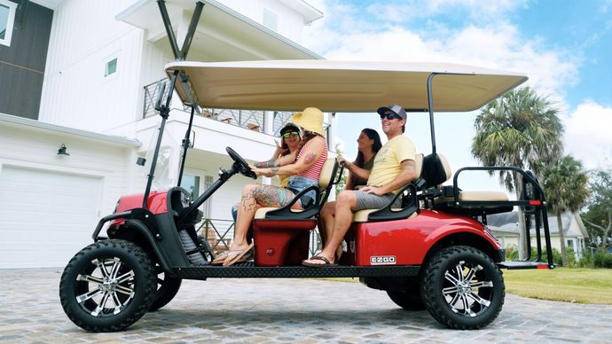 friends in a golf cart rental at Santa Rosa beach in Florida