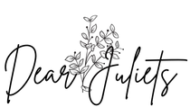 A black and white logo for dear juliets with flowers and leaves.