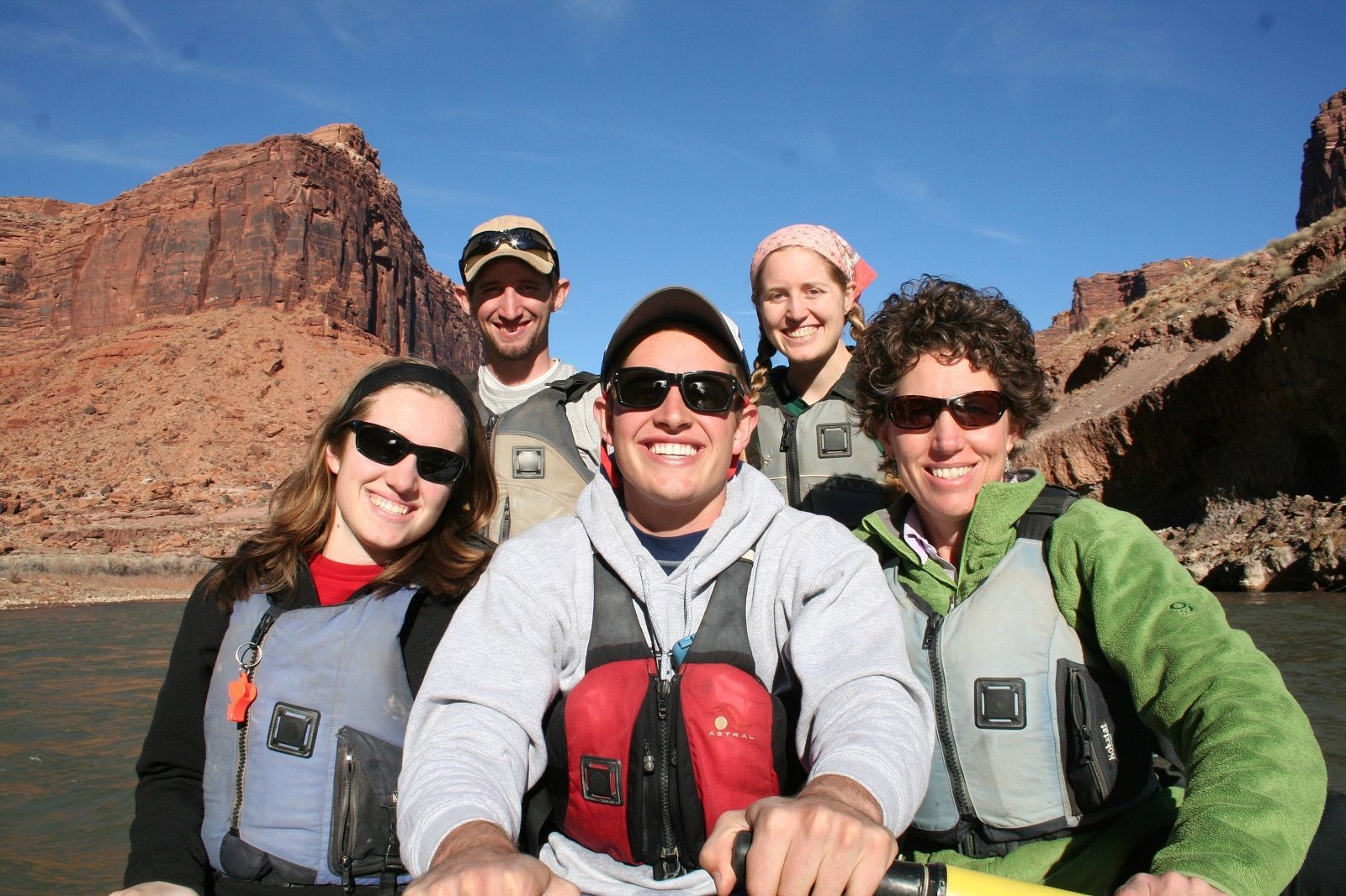 A group of people are posing for a picture on a raft