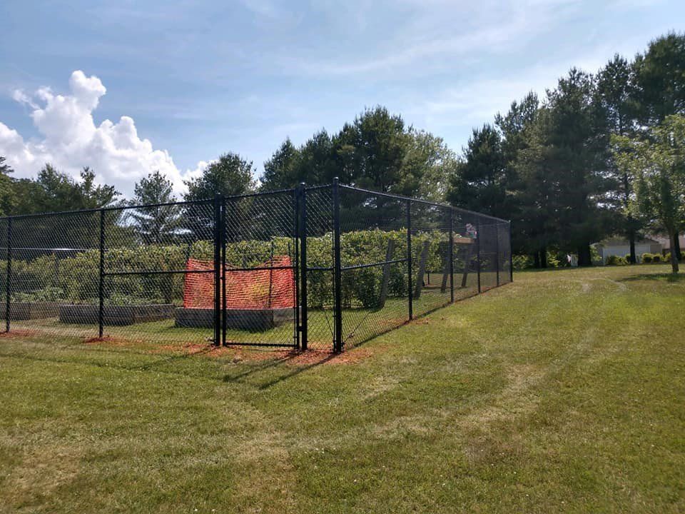 Chain Link Fence Surrounding Large Garden