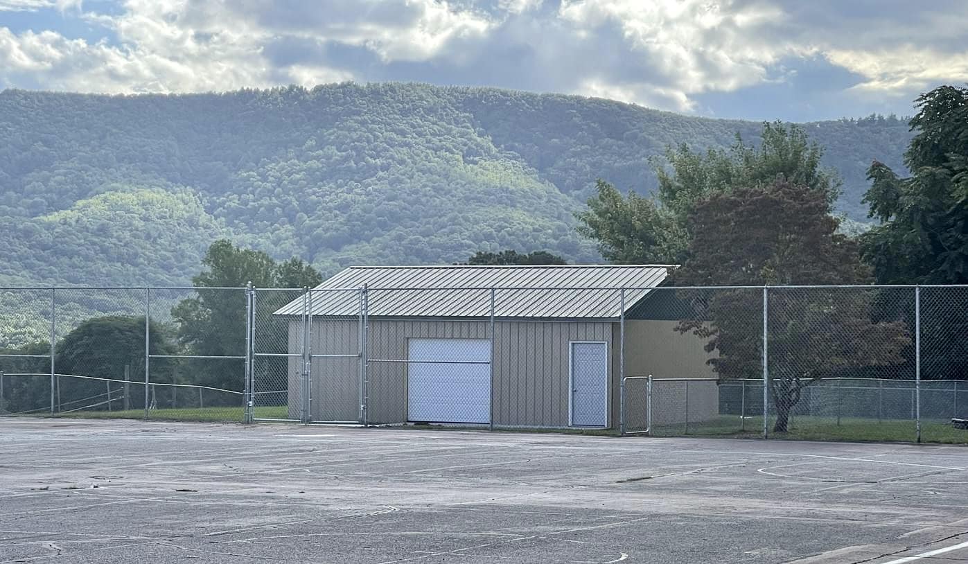 tall chain link fence enclosing park