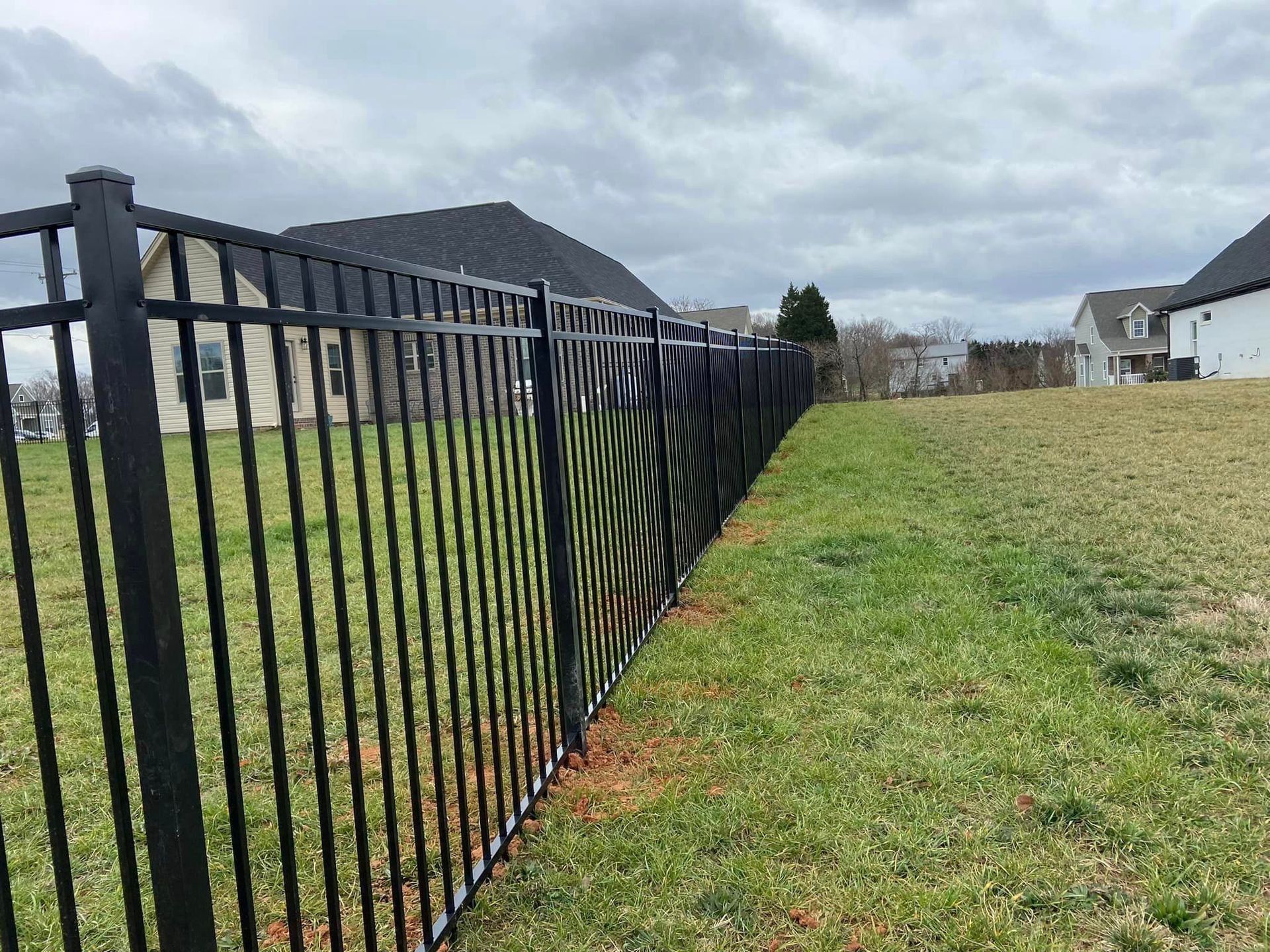 new black aluminum fencing along property lines