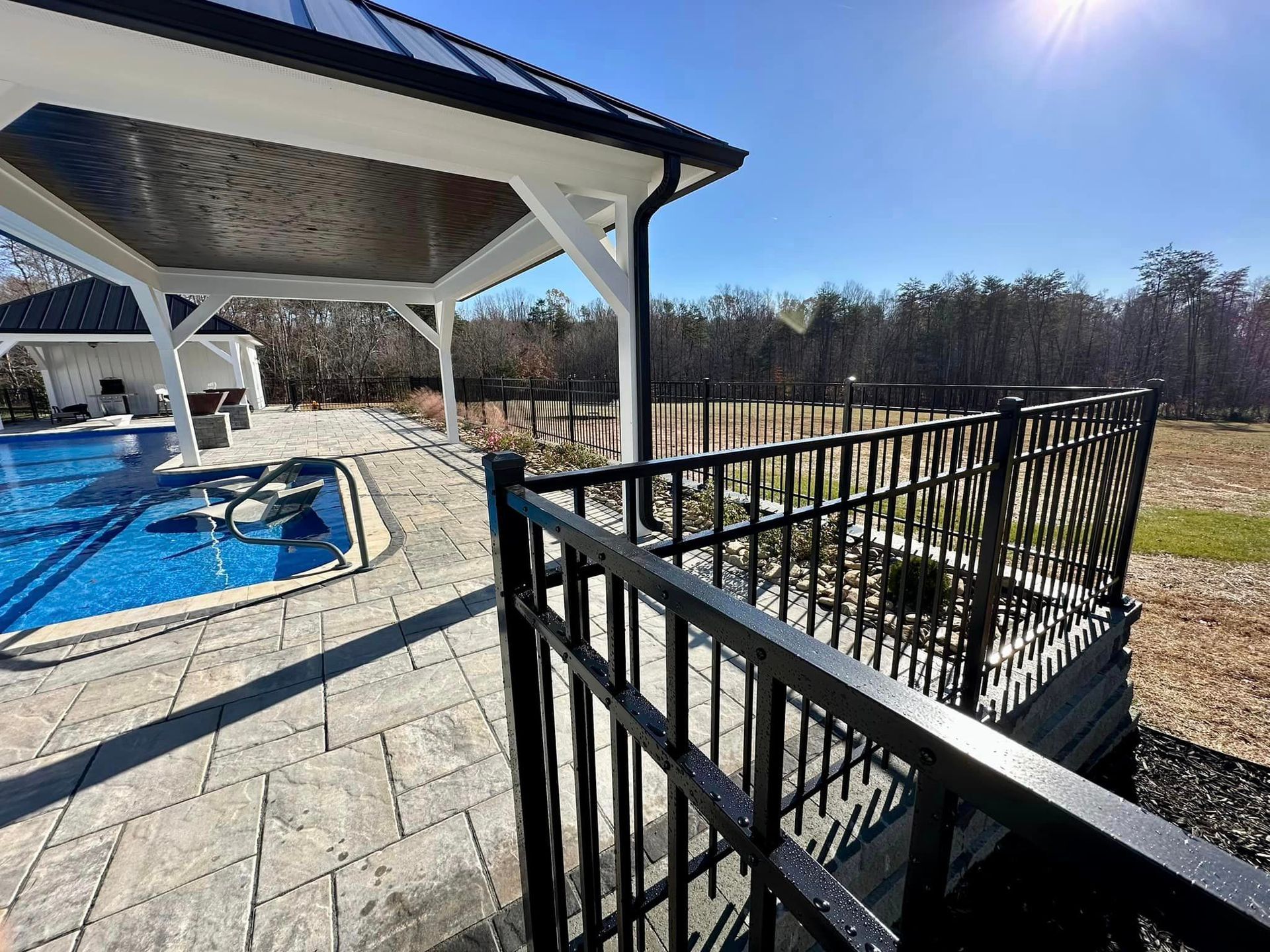 Aluminum fencing enclosing pool