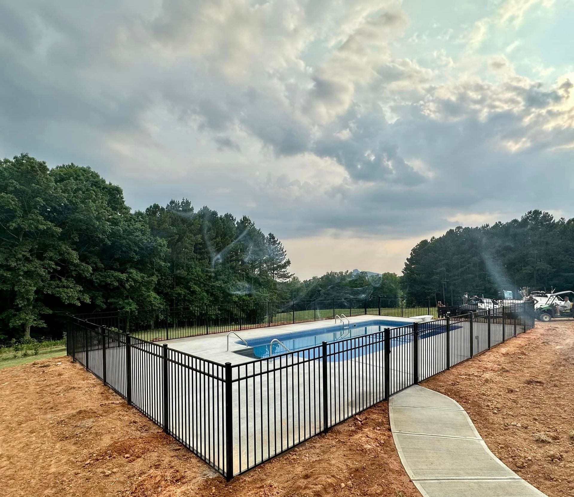 Aluminum fencing enclosing pool