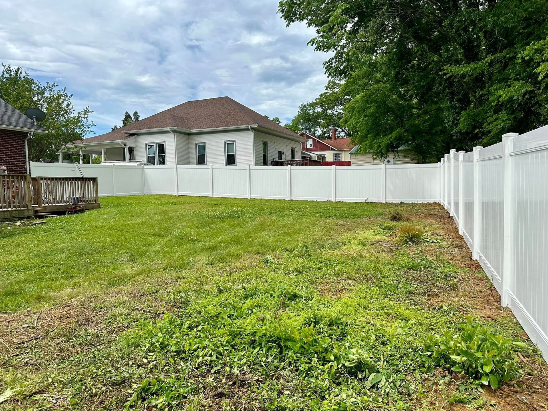 white vinyl fencing enclosing the backyard