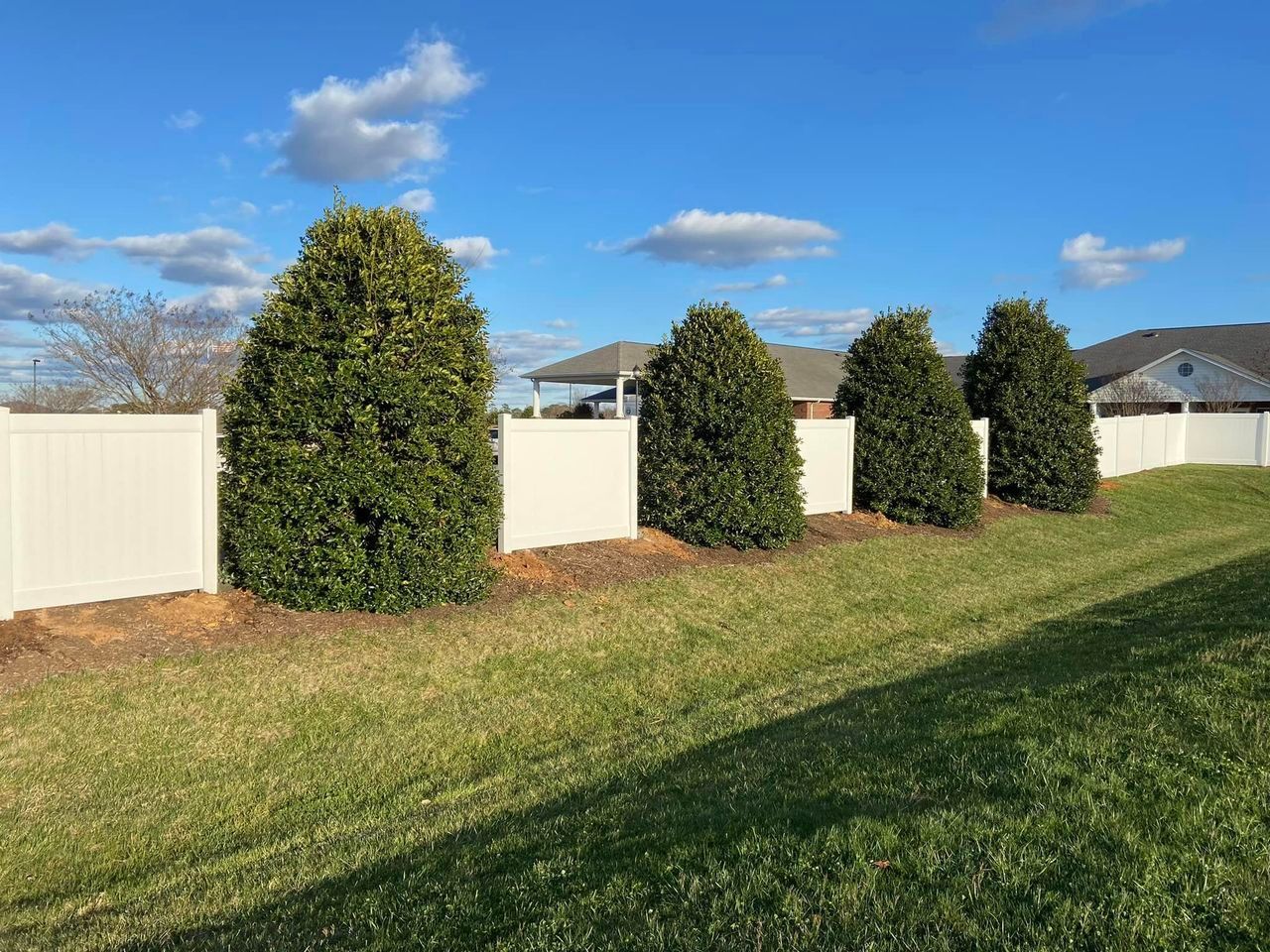 vinyl fencing and shrubs