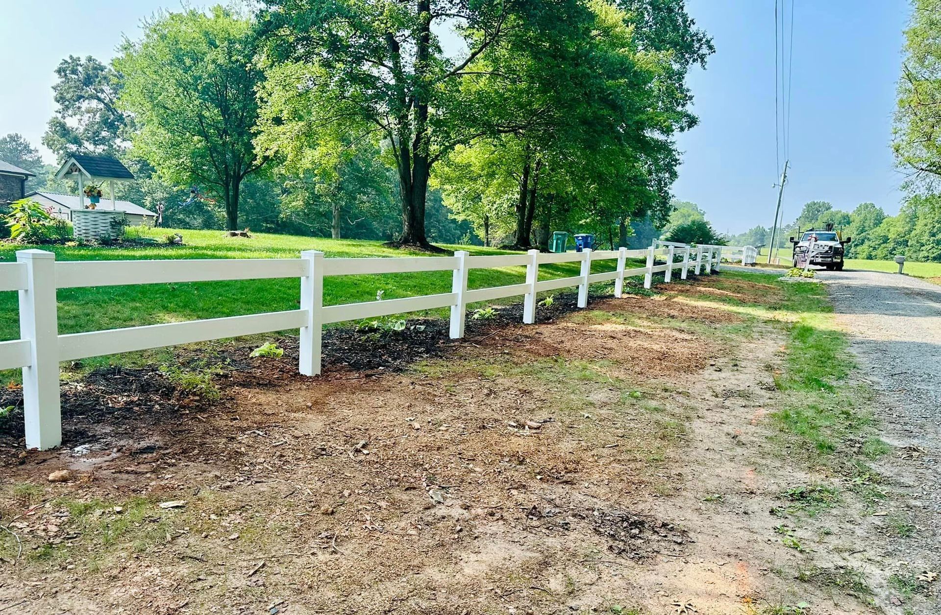white vinyl fencing lining property