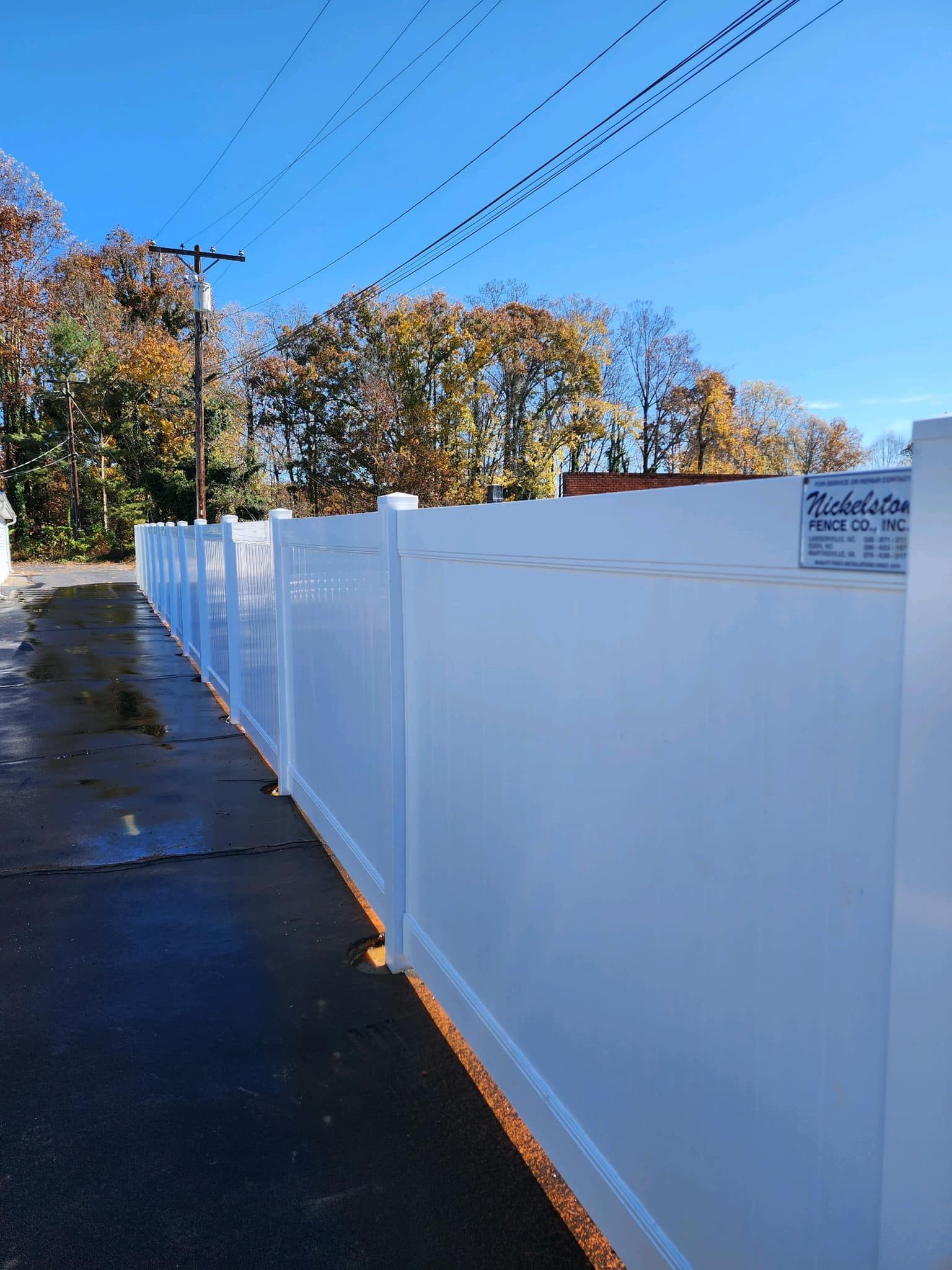Tall white vinyl fencing