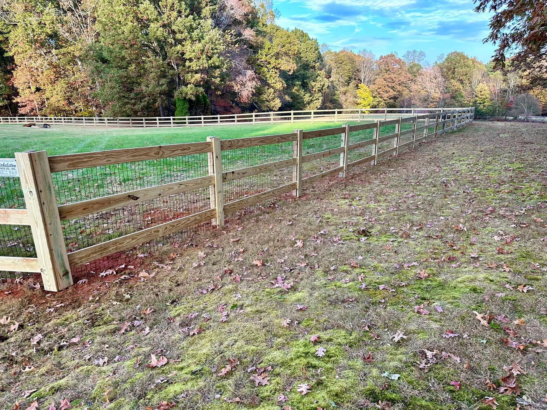 wood fencing enclosing animals on residential property