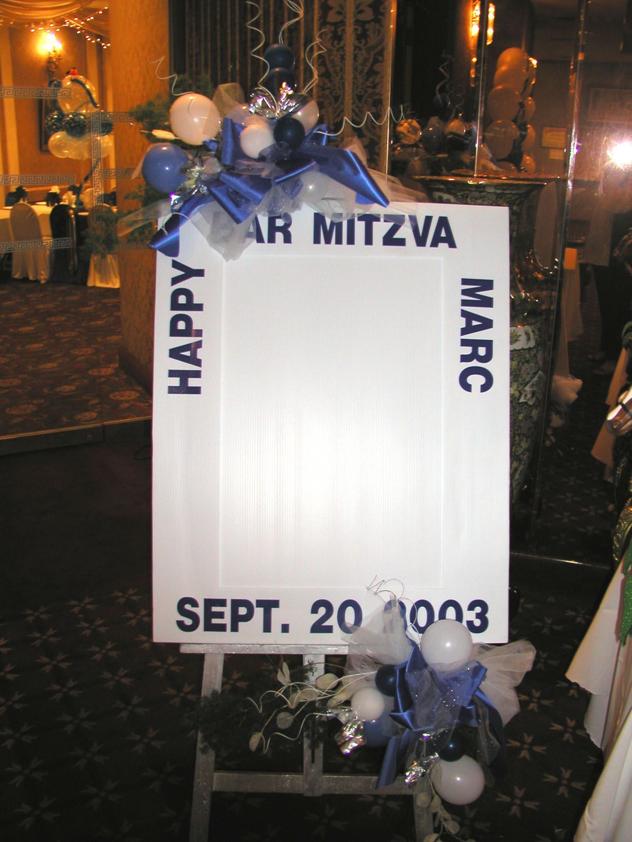 White sign on an easel with 