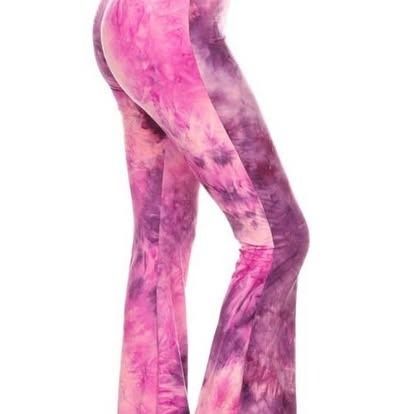 Pink and purple tie-dye flared pants on a white background.