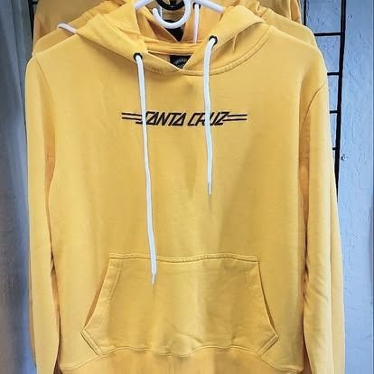 Yellow Santa Cruz hoodie with white drawstring and pocket, hanging on a rack.