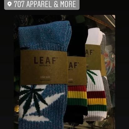 Socks displayed at 707 Apparel & More, with cannabis leaf designs and Leaf Republic labels.
