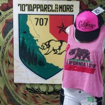 Apparel display: pink top and hat, California bear logo, alongside a 707 Apparel sign.