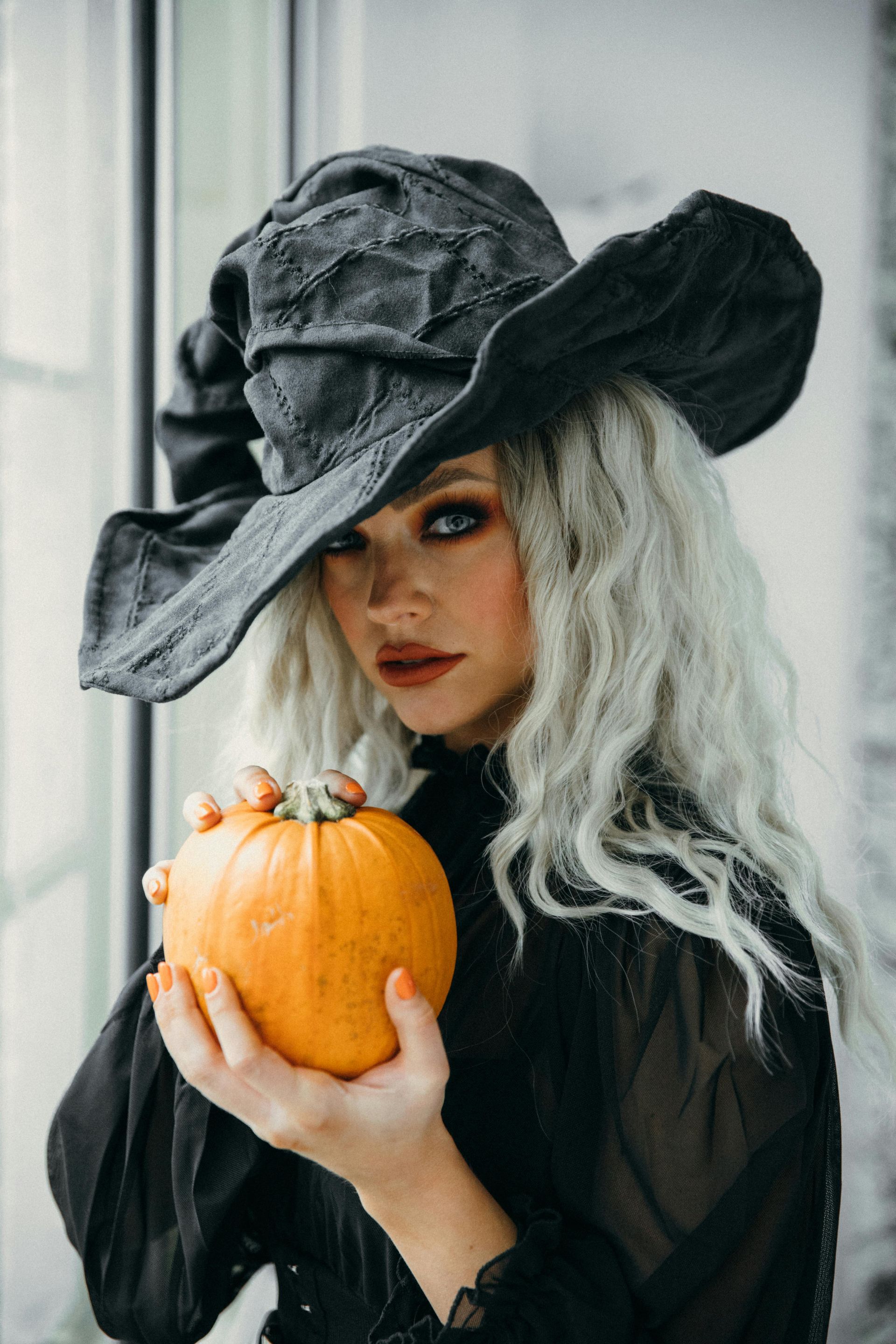witch holding a pumpkin