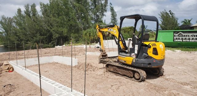 Small Yellow Excavator — Cape Coral, FL — Channel Mark Shell