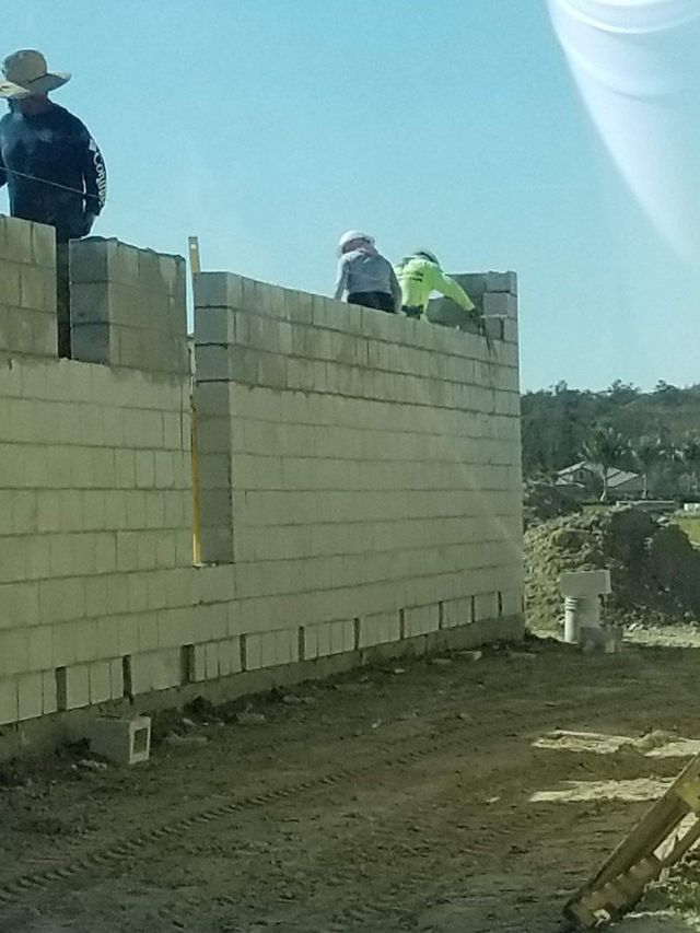 Construction Workers Working on a Brick Wall — Cape Coral, FL — Channel Mark Shell 
