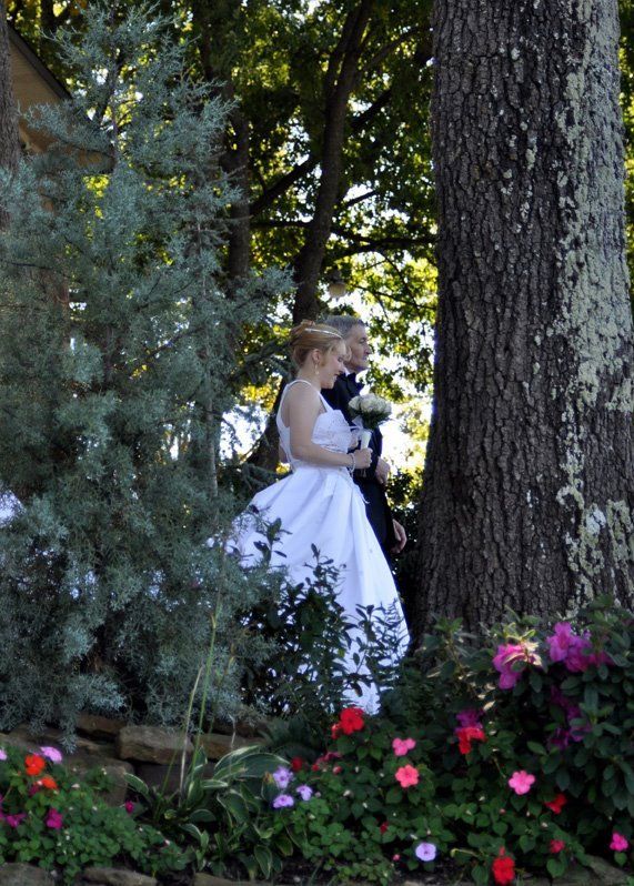 bride being walked down aisle by father