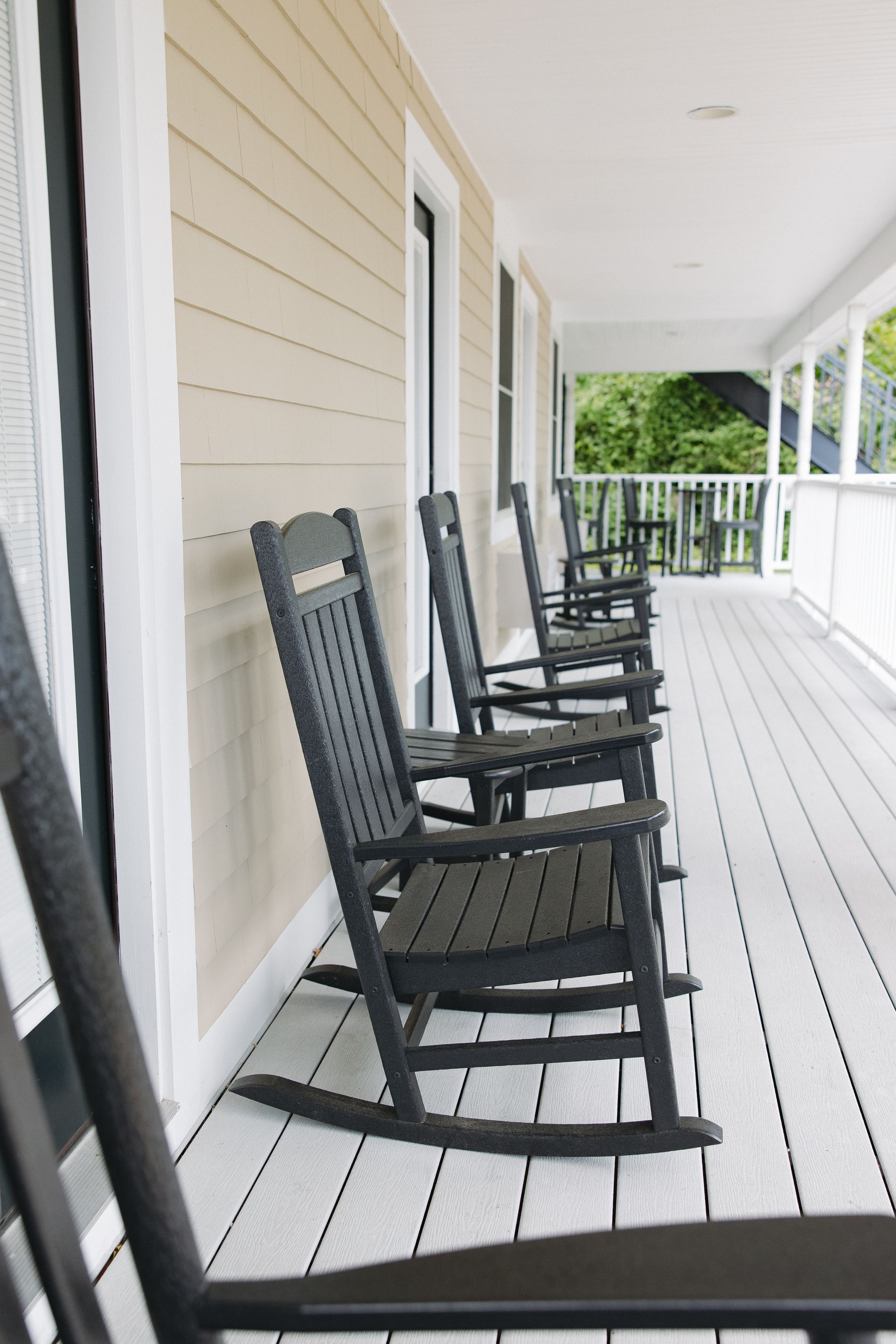 A bathroom sink with a mirror and a bottle of lotion on the counter.