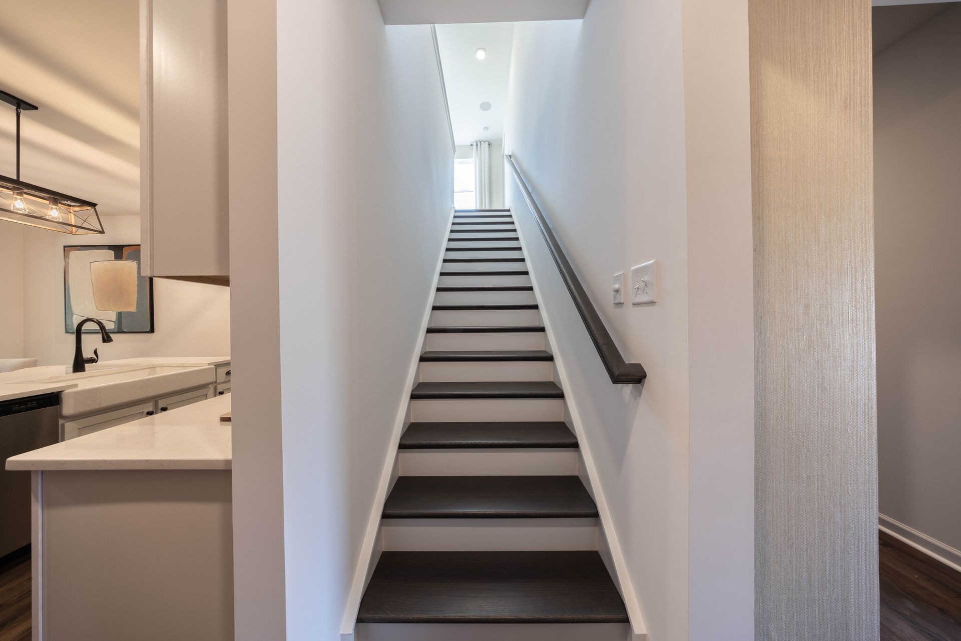 A set of stairs leading up to the second floor of a house - Abigale Floorplan by True Homes.