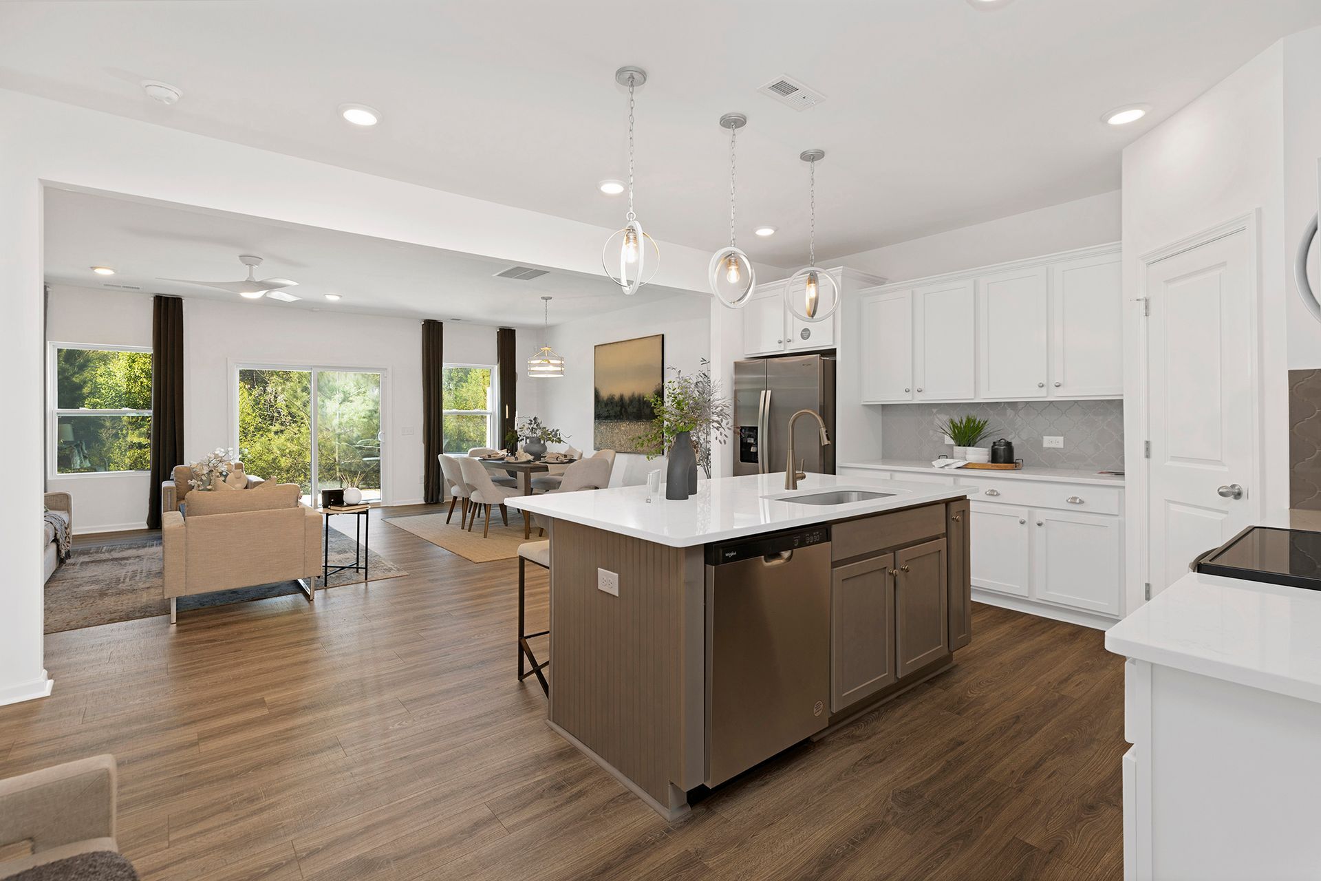 A kitchen with a large island in the middle of the room.