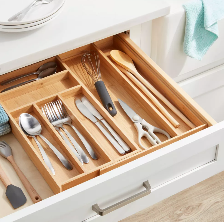 A kitchen drawer filled with silverware and utensils