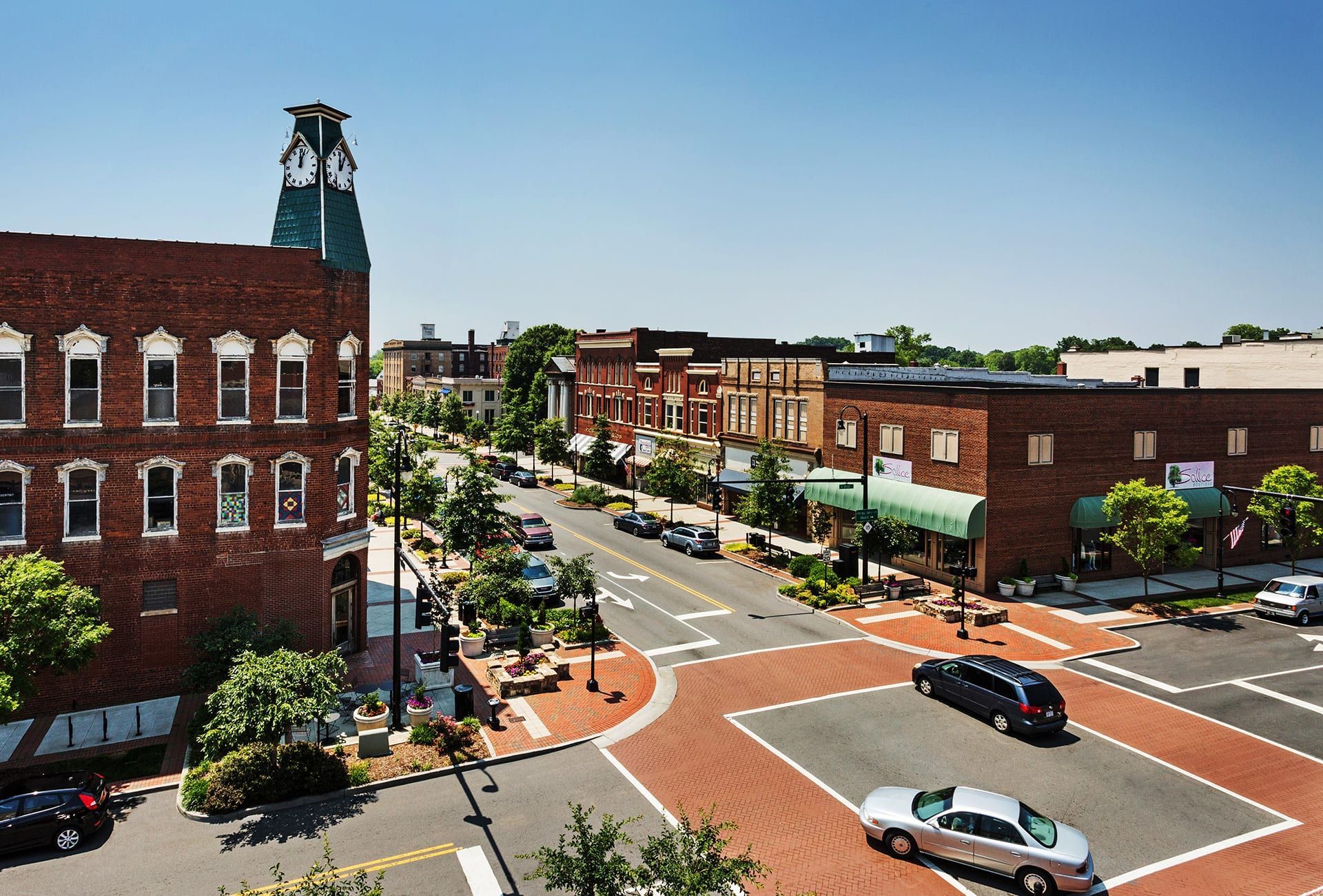 An aerial view of a small town with a clock tower